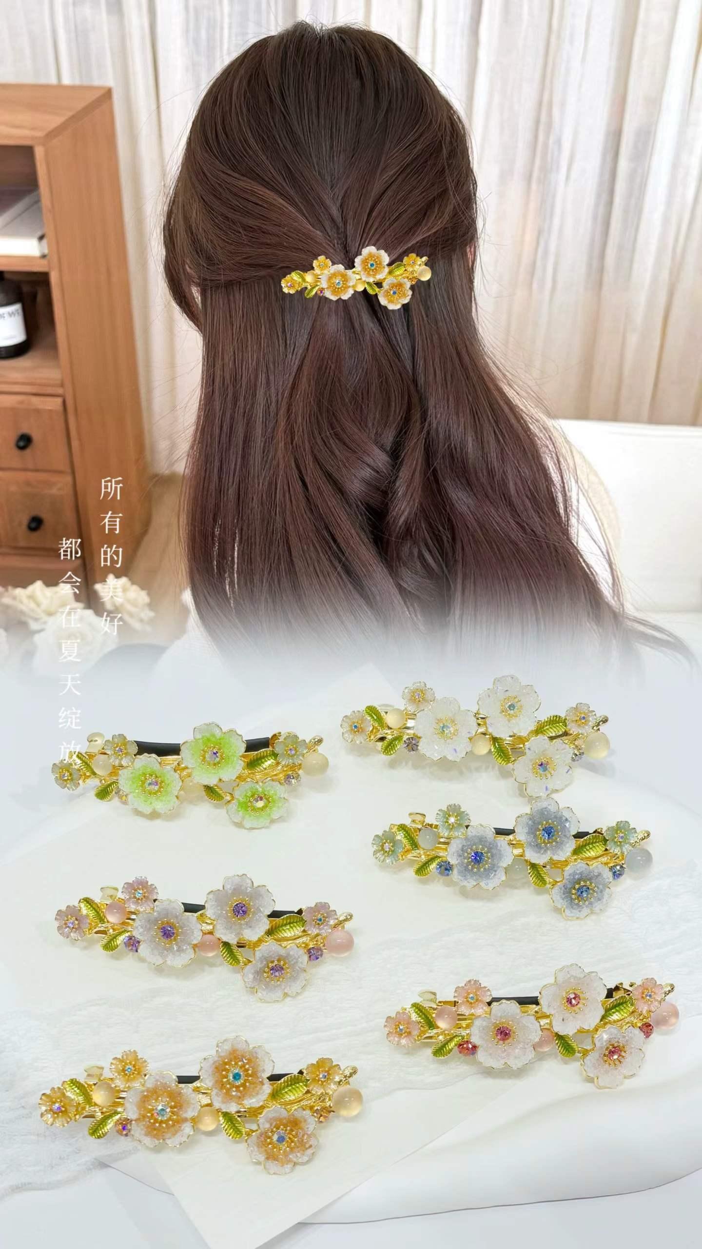 Gold pearl flower claw clip in a half-up hairstyle