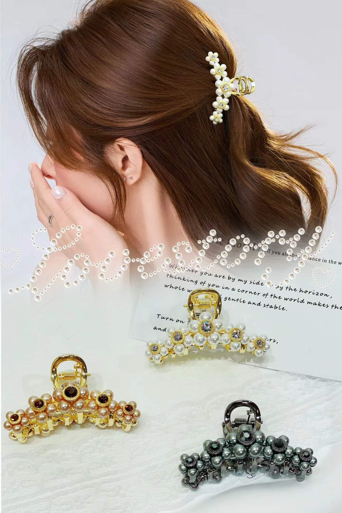 Pearl and gold flower hair clips in gold, rose gold and gunmetal finishes